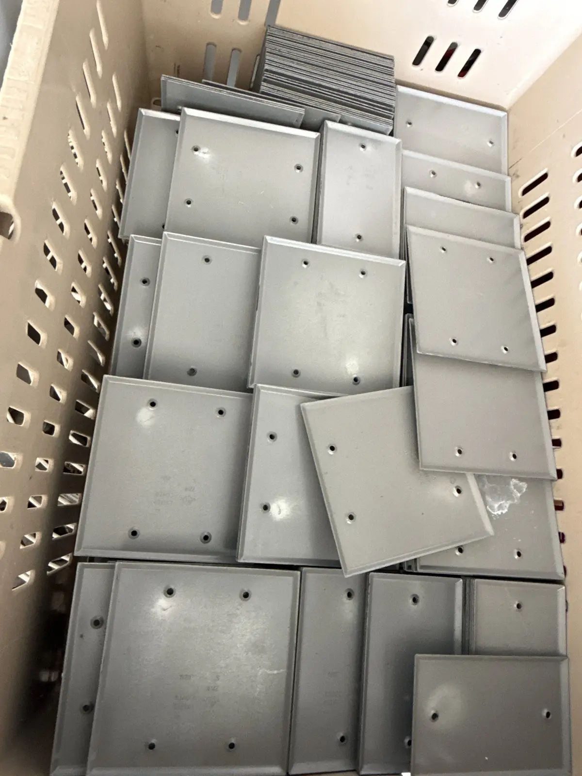 Bulk Bin of Steel Weatherproof Blank Cover Plates - 1-Gang & 2-Gang, Gray - 1,065 Pieces | Chesterton, IN