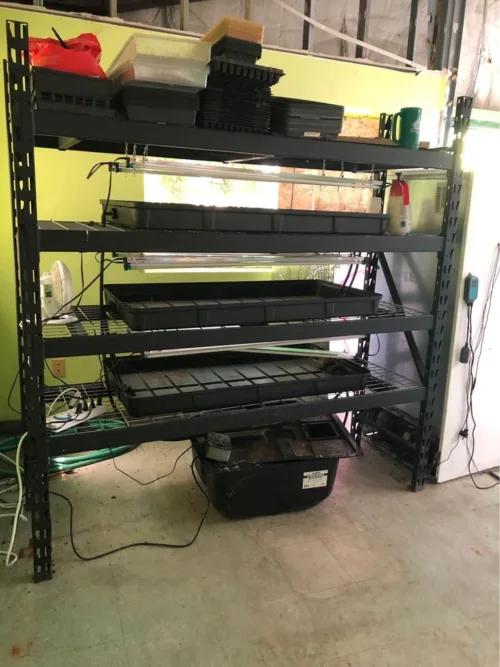 Pre-owned ZipGrow Indoor Hydroponic Farming System showcasing an array of growing racks, lighting, and climate control equipment.