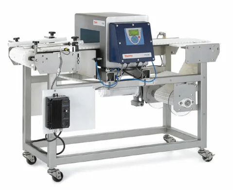 Used Apex 500 Rx Metal Detector with Conveyor System encased in a stainless steel case, stationed in Wisconsin for pharmaceutical metal detection.