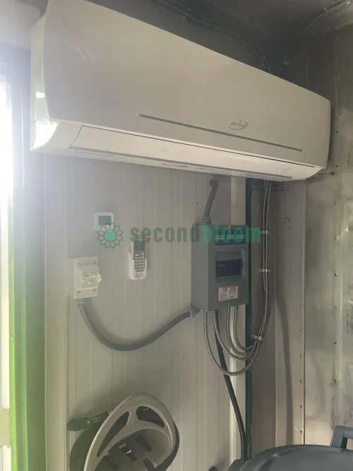 Close-up of the 2400 BTU mini-split AC unit inside a reefer container.