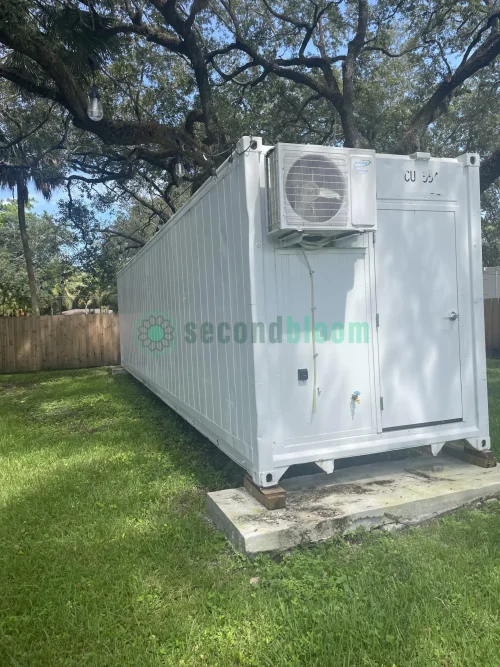 20-foot reefer container optimized for microgreen farming with door open.