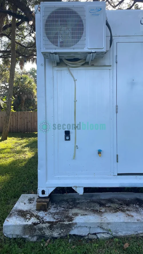 20-foot reefer container optimized for microgreen farming with door open.