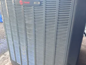 Photo of Trane 4TTR4060L1000A air conditioning unit, showcasing its robust design and Climatuff Scroll Compressor.