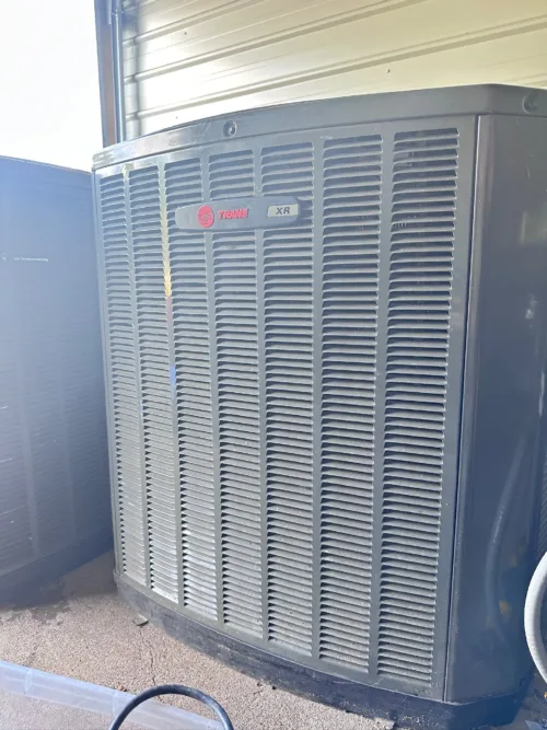 Photo of Trane 4TTR4060L1000A air conditioning unit, showcasing its robust design and Climatuff Scroll Compressor.