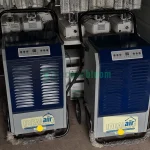Two Model 701600 dehumidifiers, featuring high capacity for moisture removal, suitable for large spaces, displayed in good condition.