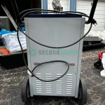 Two Model 701600 dehumidifiers, featuring high capacity for moisture removal, suitable for large spaces, displayed in good condition.