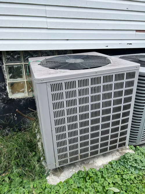 Image of a used Rheem 5 Ton Heat Pump RHPL-HM6024JC, showcasing its large size and robust construction.