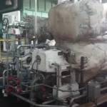 2005 Dresser Rand steam turbine generator set in a greenhouse farming environment, demonstrating its application in sustainable agriculture.