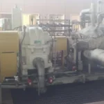 2005 Dresser Rand steam turbine generator set in a greenhouse farming environment, demonstrating its application in sustainable agriculture.