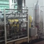 2005 Dresser Rand steam turbine generator set in a greenhouse farming environment, demonstrating its application in sustainable agriculture.
