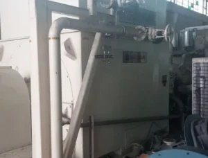 2005 Dresser Rand steam turbine generator set in a greenhouse farming environment, demonstrating its application in sustainable agriculture.