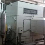 2005 Dresser Rand steam turbine generator set in a greenhouse farming environment, demonstrating its application in sustainable agriculture.