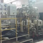 2005 Dresser Rand steam turbine generator set in a greenhouse farming environment, demonstrating its application in sustainable agriculture.