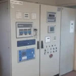 2005 Dresser Rand steam turbine generator set in a greenhouse farming environment, demonstrating its application in sustainable agriculture.