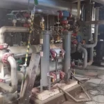 2005 Dresser Rand steam turbine generator set in a greenhouse farming environment, demonstrating its application in sustainable agriculture.