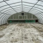 Interior view of the vent end of the X.S. Smith Quonset Cold Frame greenhouse labeled CF03 at White's Greenhouse Auction on SecondBloom Auctions platform, featuring essential vent equipment.