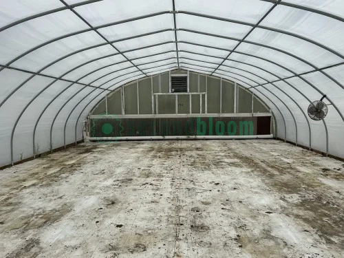 Interior view of the vent end of the X.S. Smith Quonset Cold Frame greenhouse labeled CF03 at White's Greenhouse Auction on SecondBloom Auctions platform, featuring essential vent equipment.