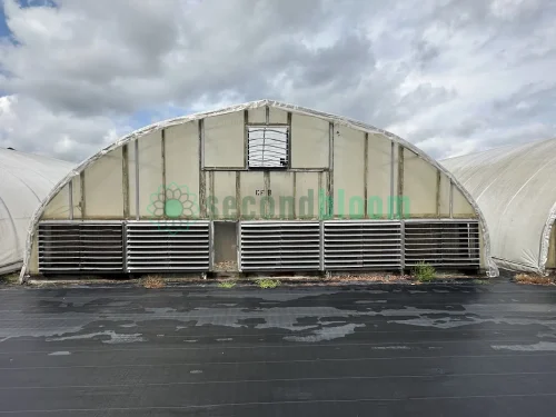 Exterior view of the vent end of the X.S. Smith Quonset Cold Frame greenhouse