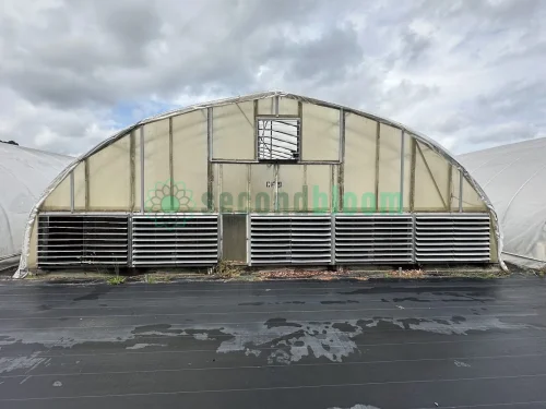 Exterior view of the vent end of the X.S. Smith Quonset Cold Frame greenhouse