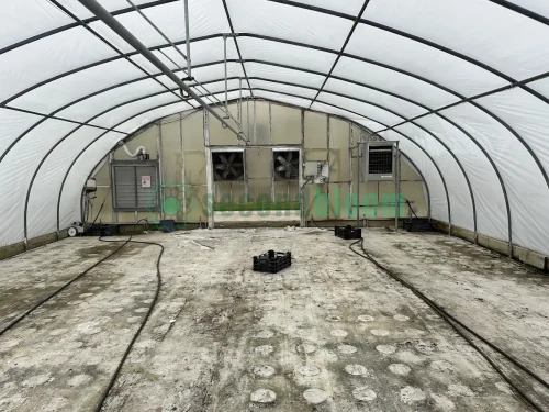 Interior view of the fan and heater end of the X.S. Smith Quonset Cold Frame greenhouse