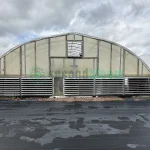 Exterior view of the vent end of the X.S. Smith Quonset Cold Frame greenhouse