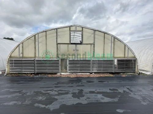 Exterior view of the vent end of the X.S. Smith Quonset Cold Frame greenhouse