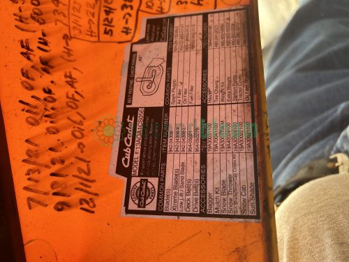 Image of the specification plate for the Cub Cadet XT1 LT42 lawn tractor, model 13AOA1CS056, detailing engine and accessory information.