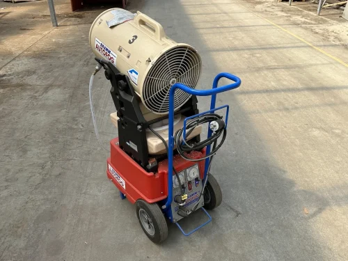 Close-up of the Dramm Large AutoFog head for efficient chemical application in greenhouses.