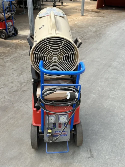 Close-up of the Dramm Large AutoFog head for efficient chemical application in greenhouses.