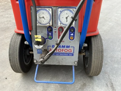 Close-up of the Dramm Large AutoFog head for efficient chemical application in greenhouses.