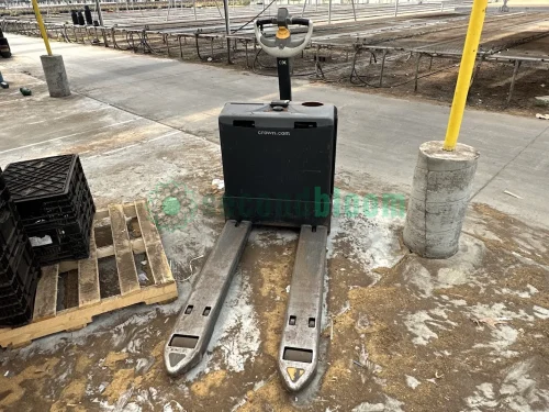 Crown WP3035-45 electric pallet jack in a warehouse setting.