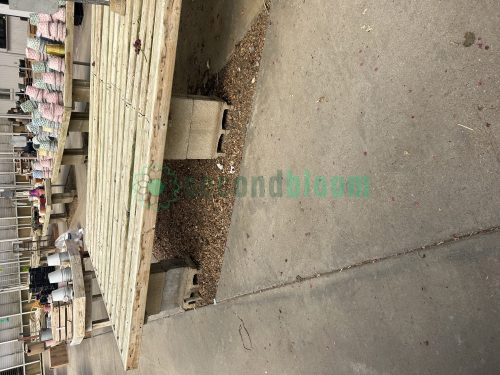 Side view of garden center greenhouse benches from White's Nursery, highlighting their durable construction and practical design for plant display.