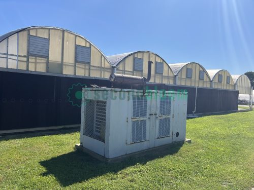 Exterior end view of the greenhouse, highlighting the entrance and overall dimensions.