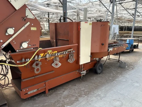 Close-up of the Javo Super Mega Potting Machine head for precise potting in horticulture.