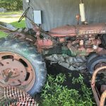 Side view of a Farmall 230 tractor showcasing its classic design and robust construction.