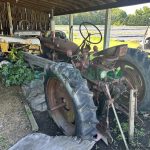 Side view of a Farmall 230 tractor showcasing its classic design and robust construction.