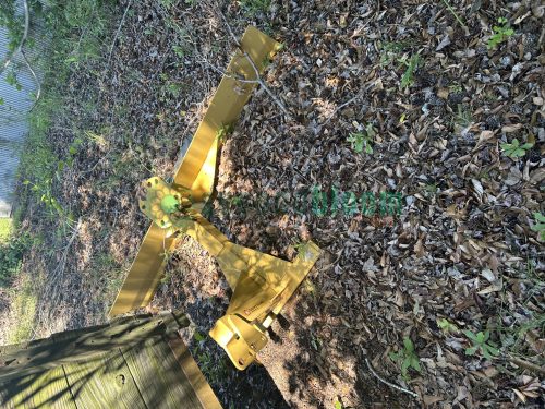 Multiple used CountyLine grader blades stacked together, each showing signs of use and sturdy construction.