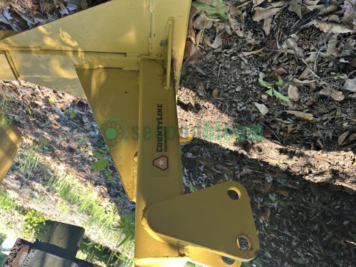 Rear view of a used CountyLine grader blade, displaying the support structure and connection points to the tractor.