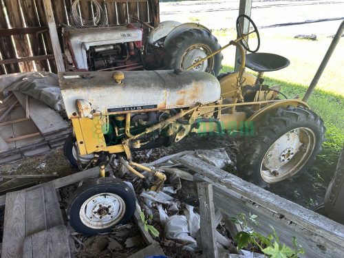 Vintage yellow and white International Cub Lo-Boy tractor side view