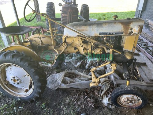 Vintage yellow and white International Cub Lo-Boy tractor side view