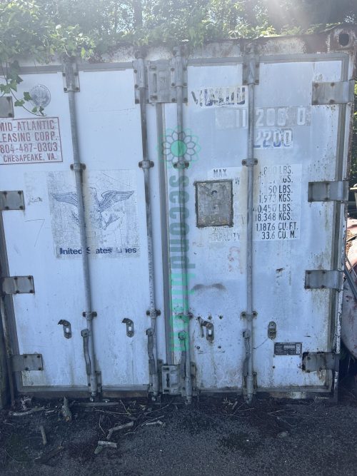 End view of a 20' shipping container available for auction at Secondbloom Auctions.