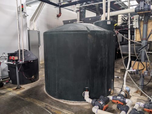 Water storage and mixing tanks in a vertical farm