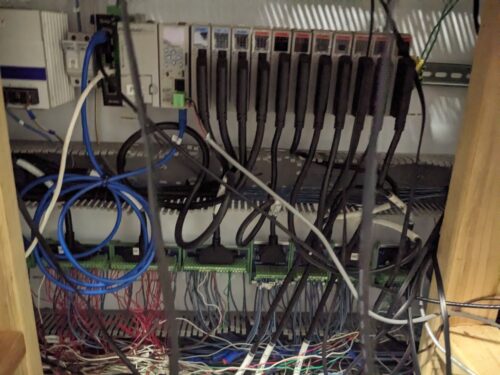 Controllers and wiring inside a control cabinet in a vertical farm