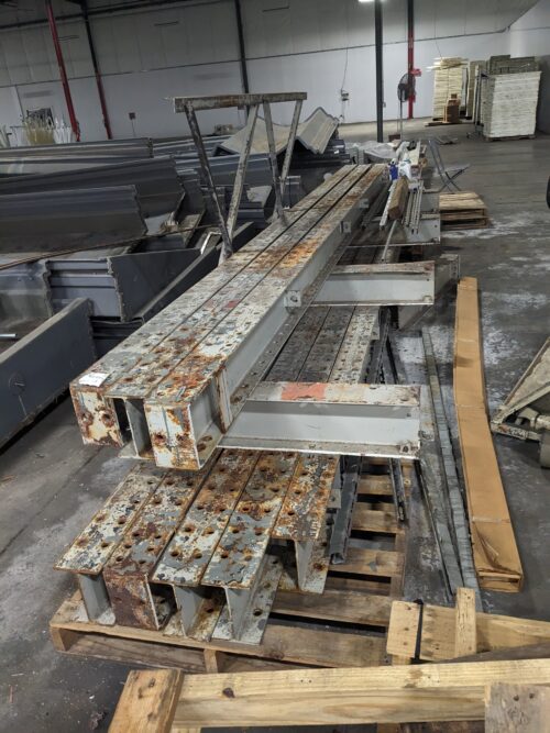 Various structural components, including beams and panels, stored as spare parts for the vertical farm system at Your Local Greens in Burlington, NC, originally from the FarmedHere system in Bedford Park, IL.