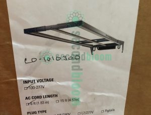 Nine professional Fluence RAZRx LED grow light fixtures arranged for auction sale, showing ultra-slim 1.2-inch profile design with modular aluminum chassis and integrated passive cooling heatsinks, each unit measuring 17.9 to 22.8 inches wide, featuring full-spectrum PhysioSpec LED arrays for commercial horticultural applications