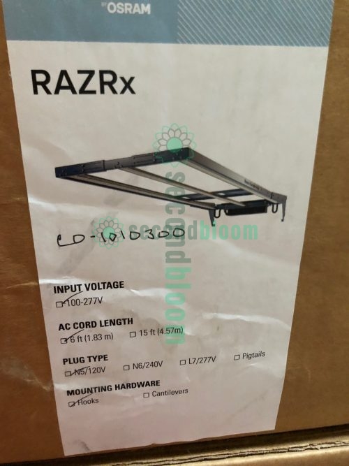 Nine professional Fluence RAZRx LED grow light fixtures arranged for auction sale, showing ultra-slim 1.2-inch profile design with modular aluminum chassis and integrated passive cooling heatsinks, each unit measuring 17.9 to 22.8 inches wide, featuring full-spectrum PhysioSpec LED arrays for commercial horticultural applications