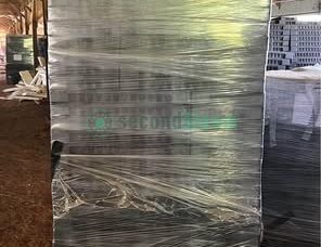 Stacked Proptek 128-cell trays wrapped in clear plastic for bulk sale."