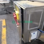 Industrial tray washer control panel with yellow and red emergency controls