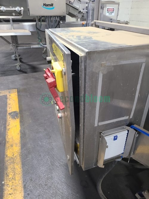 Industrial tray washer control panel with yellow and red emergency controls