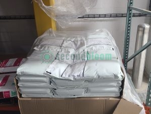 Box of 46 bags of Bowery 6-11-30 water-soluble fertilizer for controlled environment agriculture on industrial shelving
